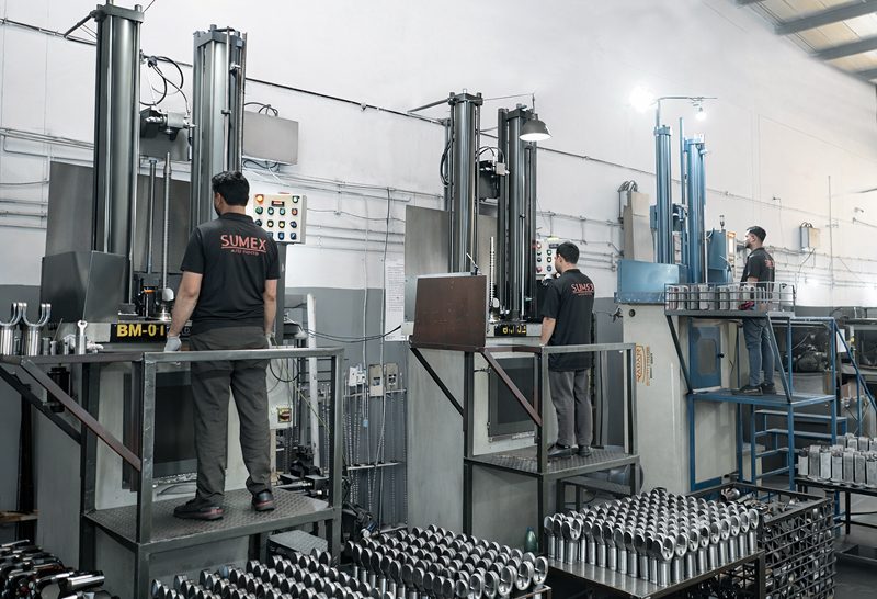 Operators at vertical broaching machines